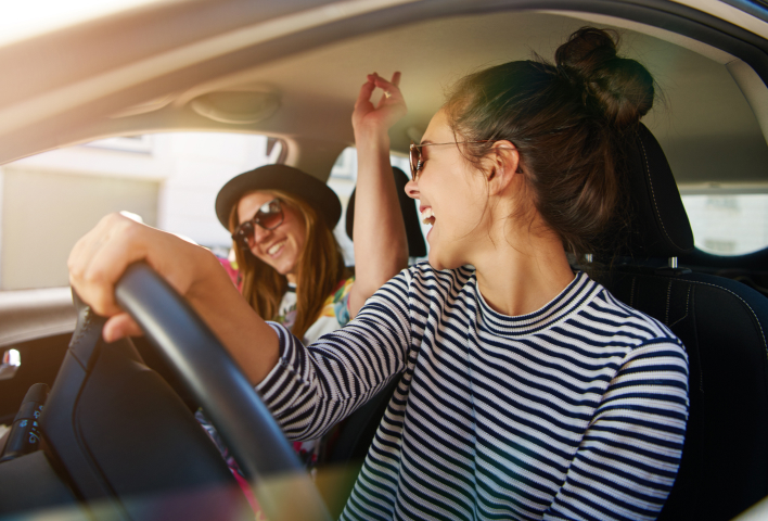 people in a car singing