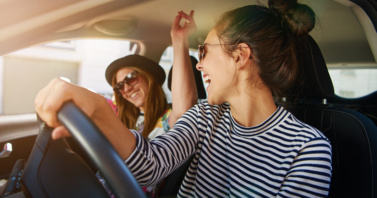 Girls driving in a car Enjoying Stingray products